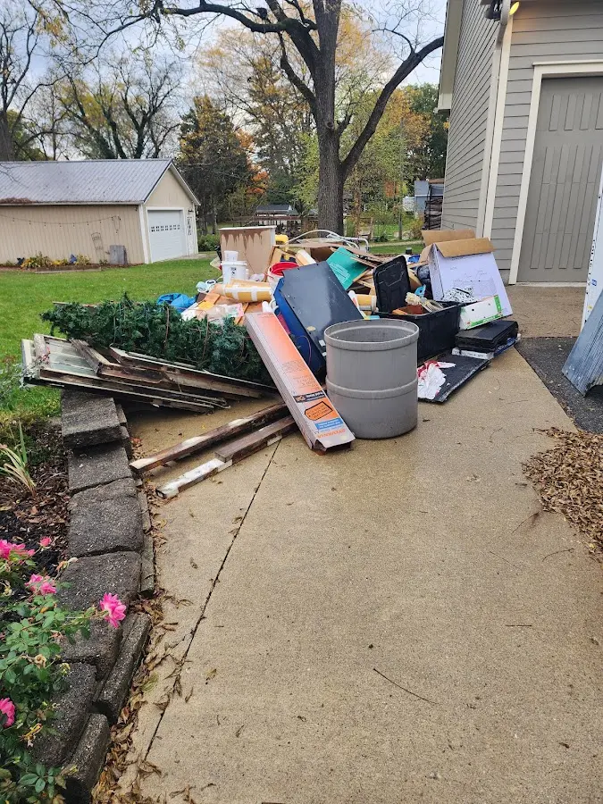 Dumpster being loaded with debris for Commercial Dumpster Rental in Withamsville